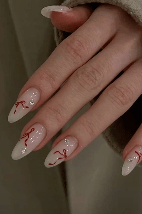 Red Bow Nails with Rhinestones | 22 Red Christmas Nails So Festive Even Rudolph Would Be Jealous