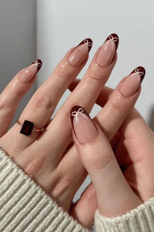 Burgundy French Tips with Pink Bows | 22 Red Christmas Nails So Festive Even Rudolph Would Be Jealous