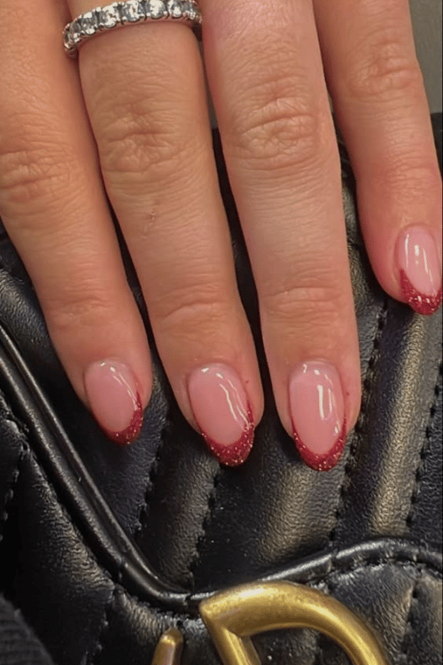 Sparkly Red French Tips | 22 Red Christmas Nails So Festive Even Rudolph Would Be Jealous