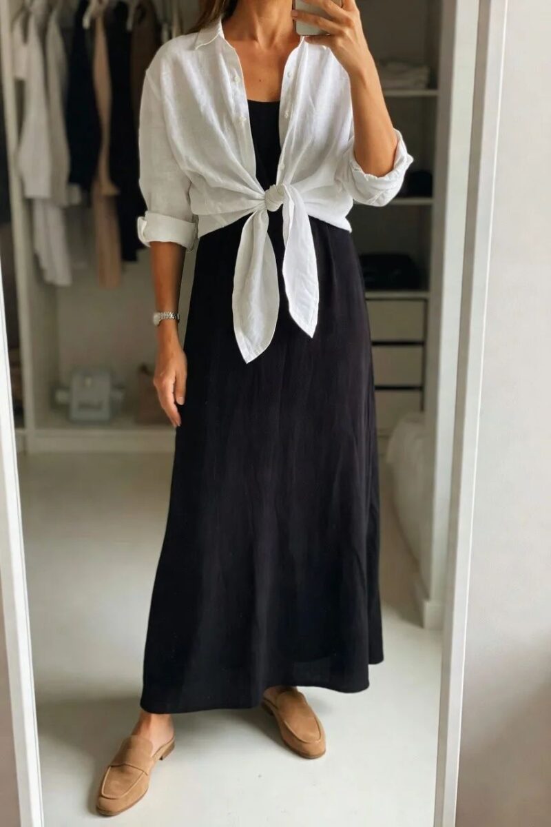white shirt tied over a black maxi dress