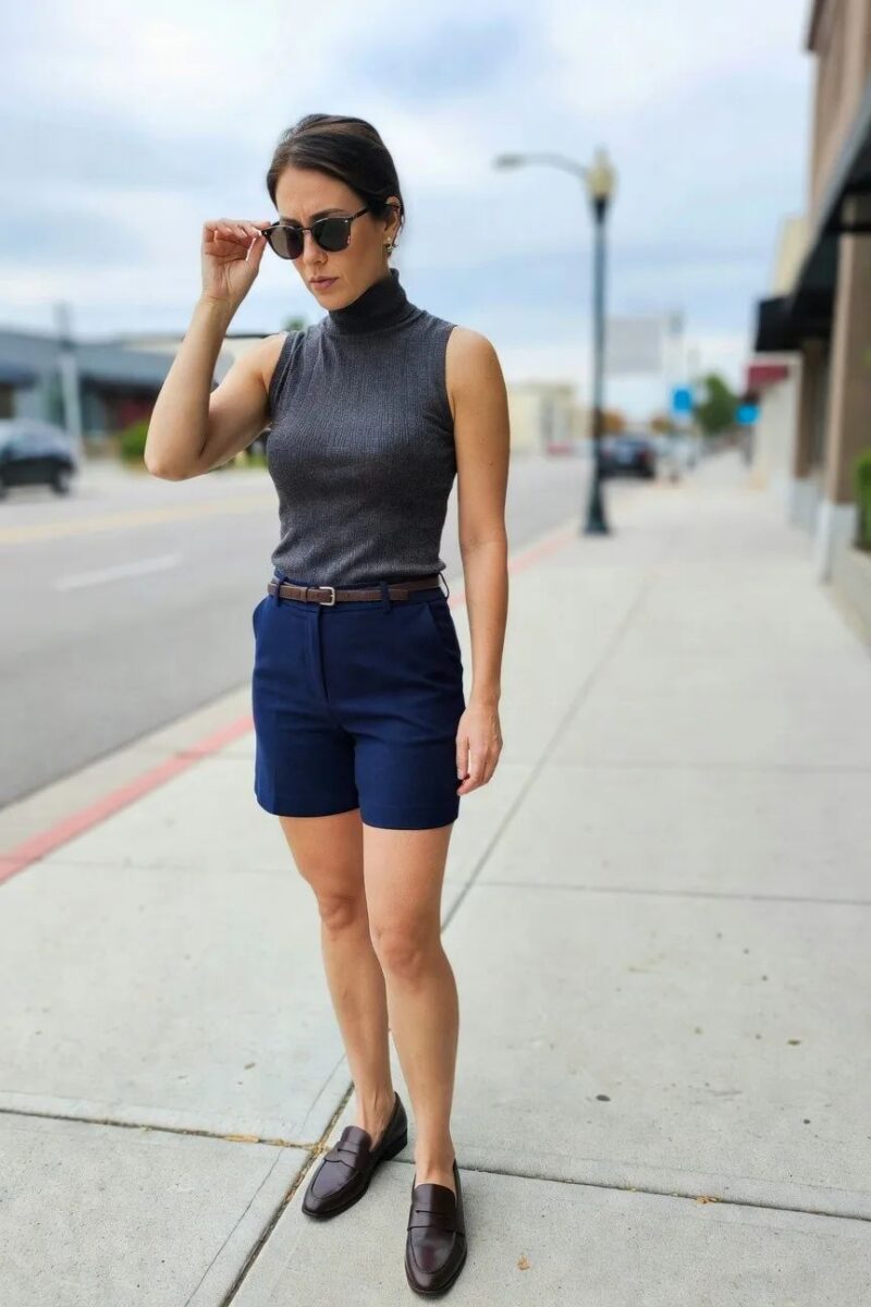 navy shorts with a ribbed sleeveless turtleneck