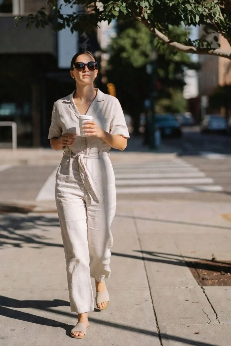 neutral linen jumpsuit with a relaxed waist tie