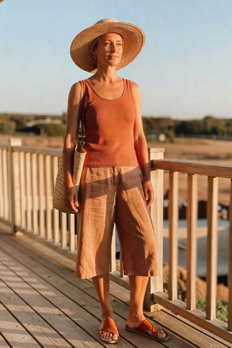 tank top with cropped pants and a wide hat