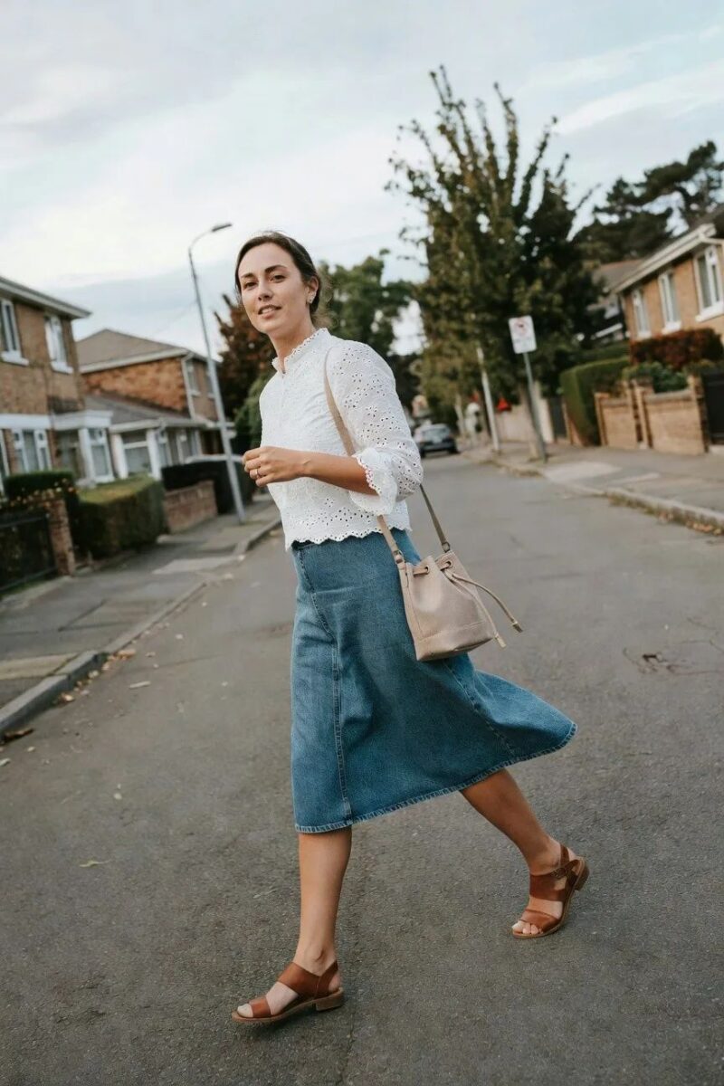 denim skirt with an eyelet blouse