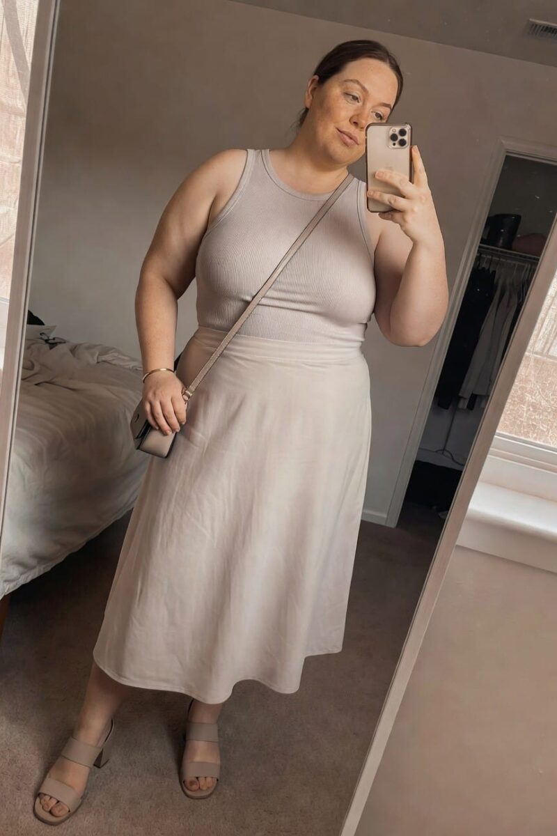 beige ribbed tank with a flowing midi skirt