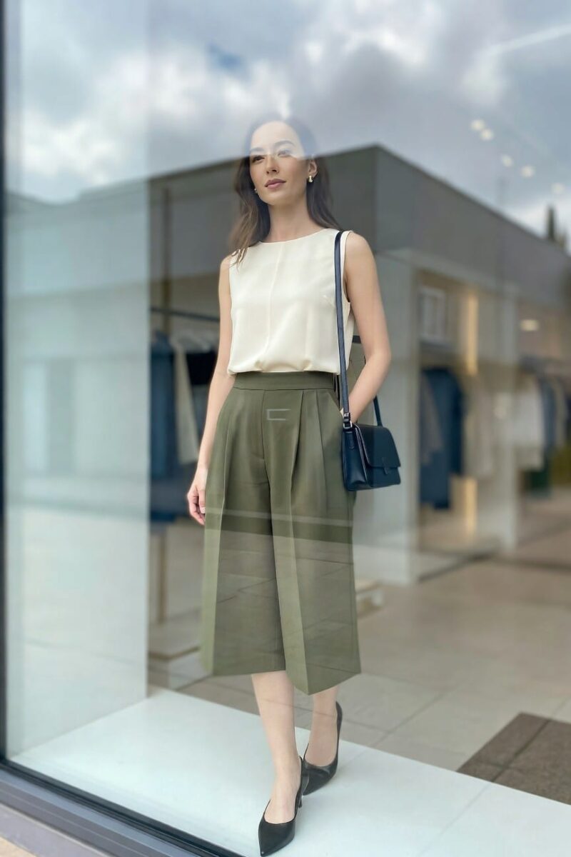 cream sleeveless top with olive pleated culottes