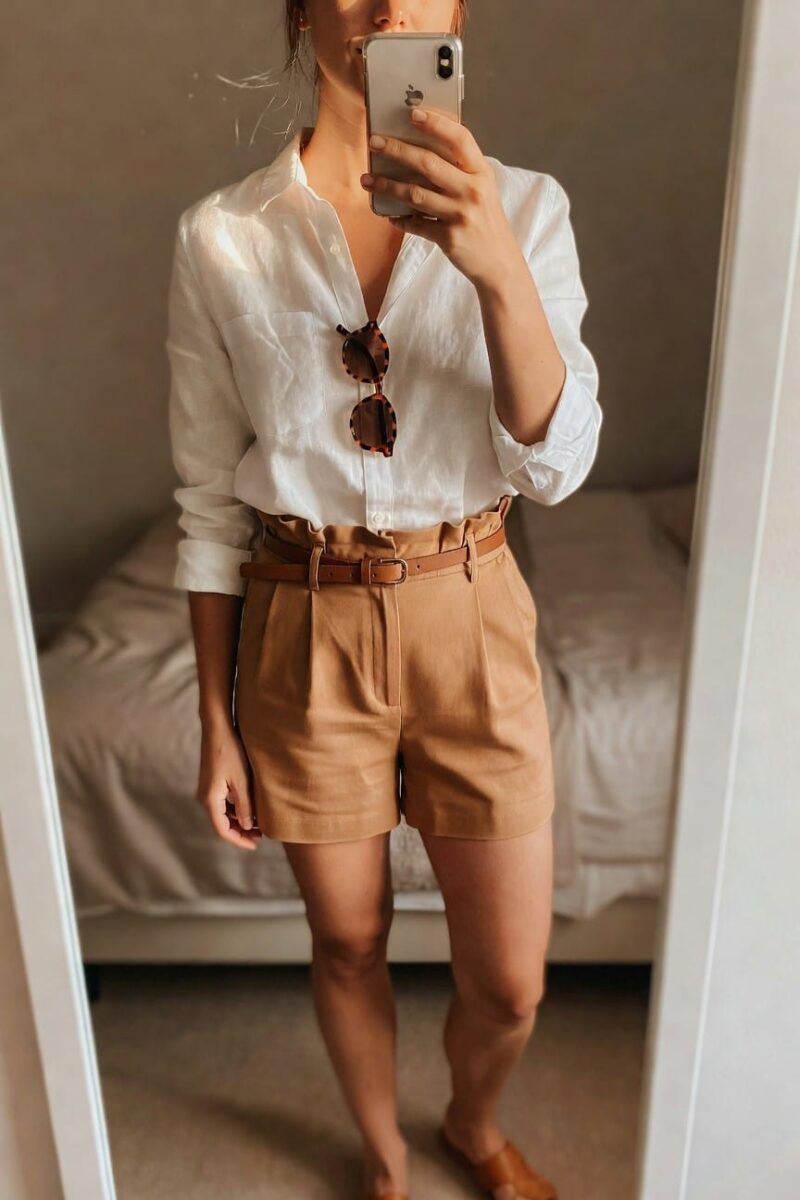 white shirt and tan pleated shorts