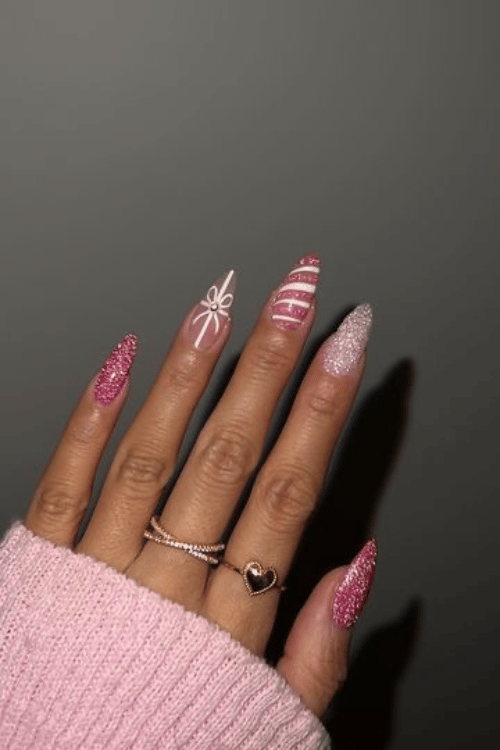 Sugarplum Bow and Candy Cane Pink Nails | Santa's Favorite 22 Pink Christmas Nails You'll Want to Copy This Holiday Season