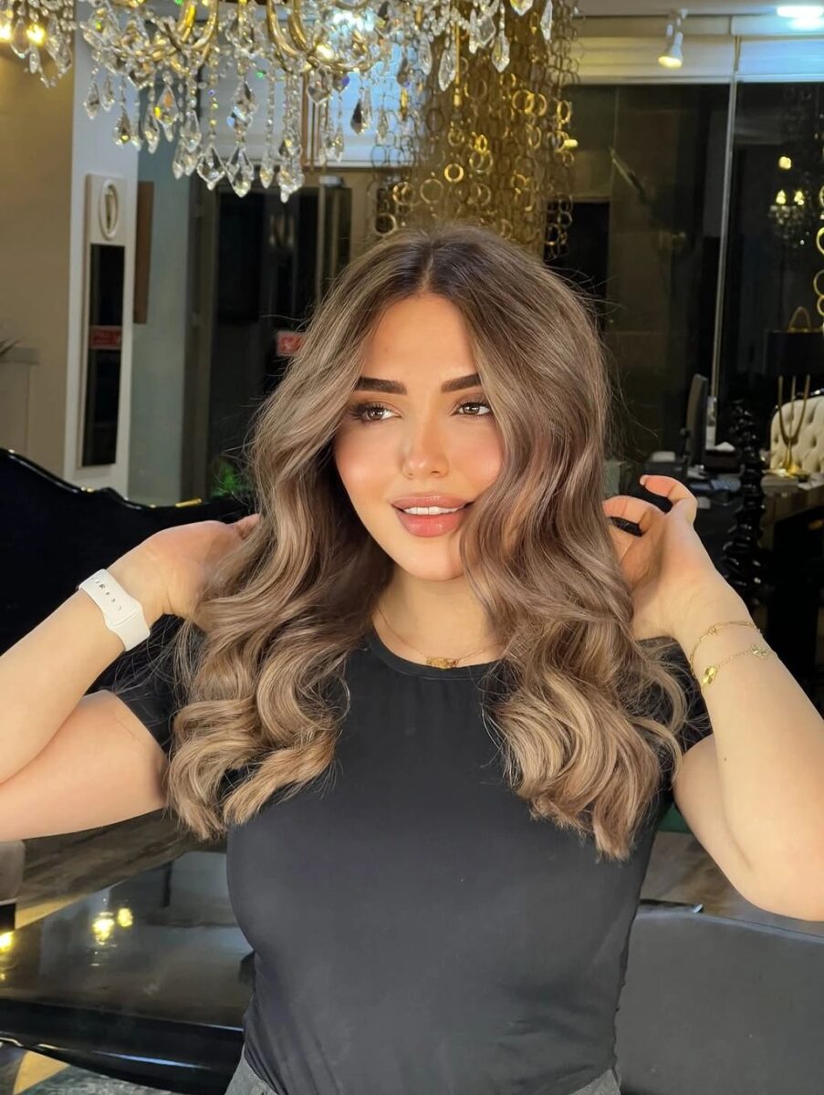 Warm beige waves with centered face-framing layers