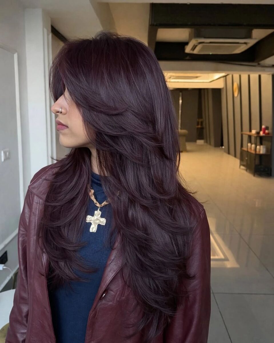 Long plum brown layered hair with berry warmth movement