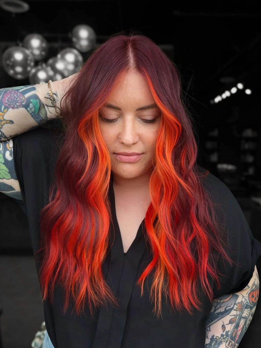 Long red waves with bright orange face-framing pieces