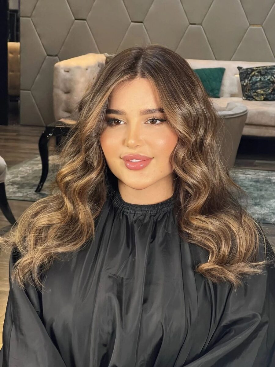 Medium brown waves with caramel face-framing highlights