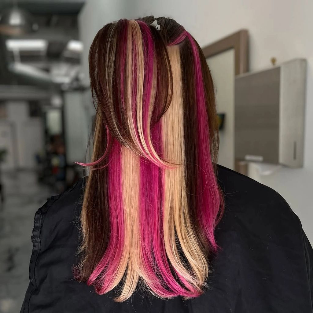 Dark layered hair with blonde and hot pink face-framing panels | Gorgeous September Hair Colour Ideas for a Fresh Autumn Refresh
