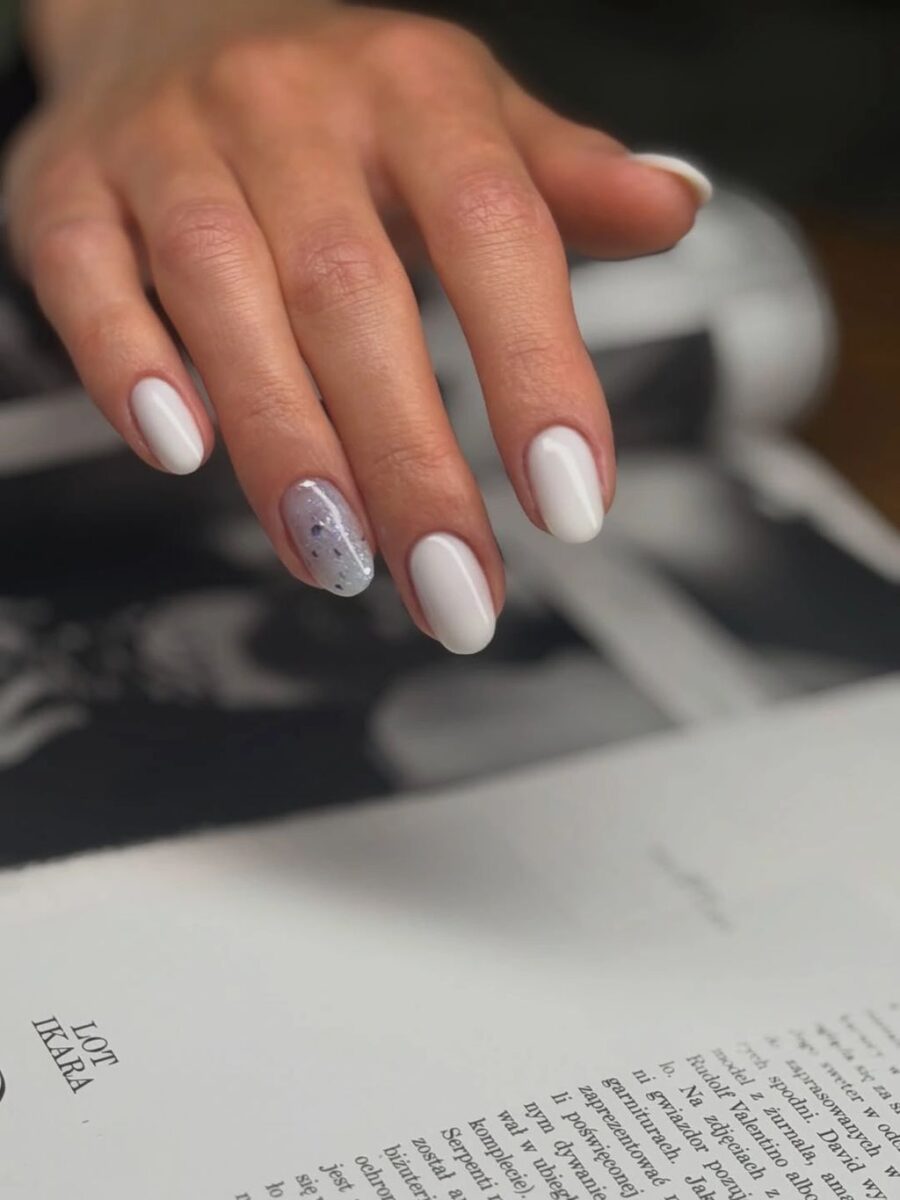 Short white square nails with one subtle silver glitter accent
