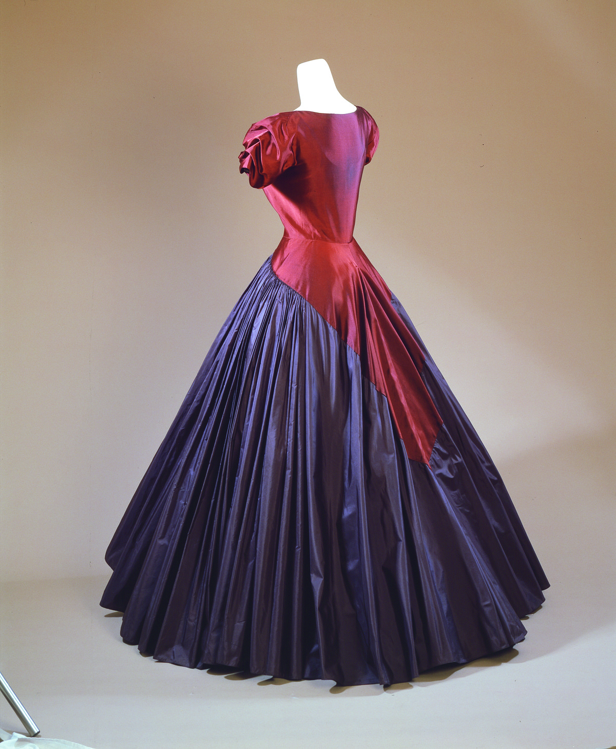 Madame Gres 1951 evening gown in purple and magenta shot silk with a full skirt, displayed on a dress form.