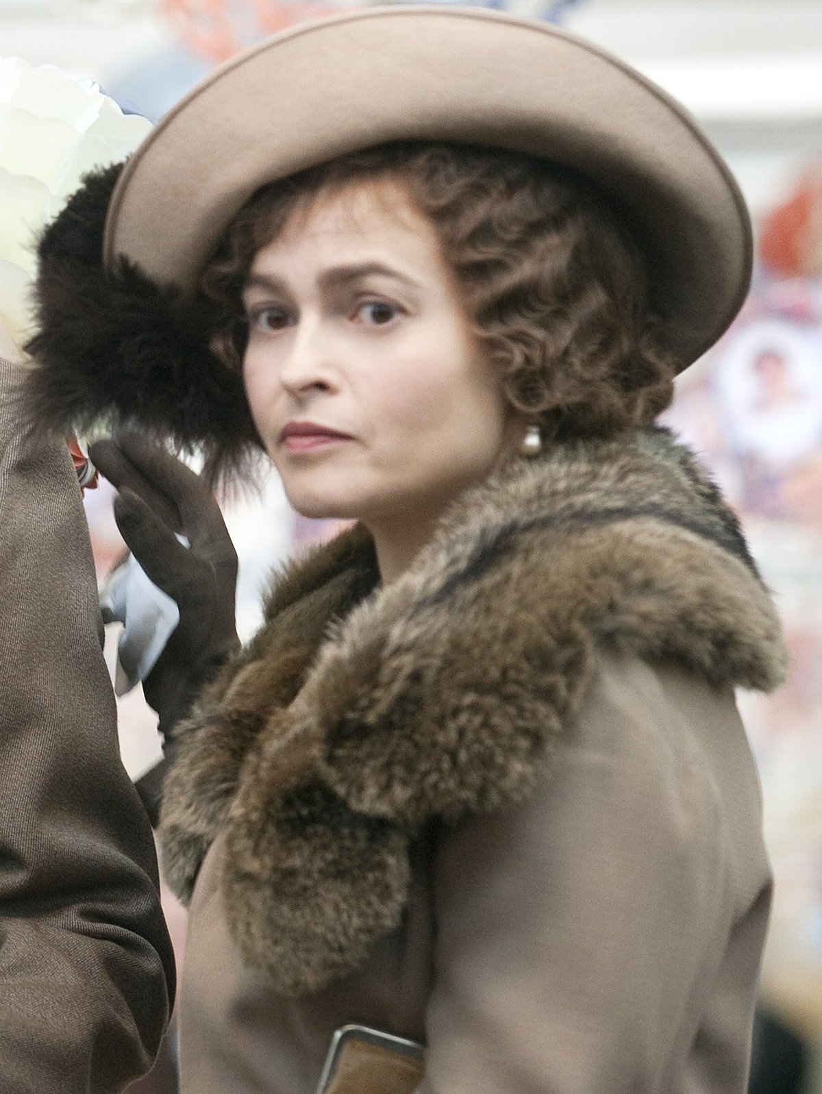 Beige coat with dark fur collar