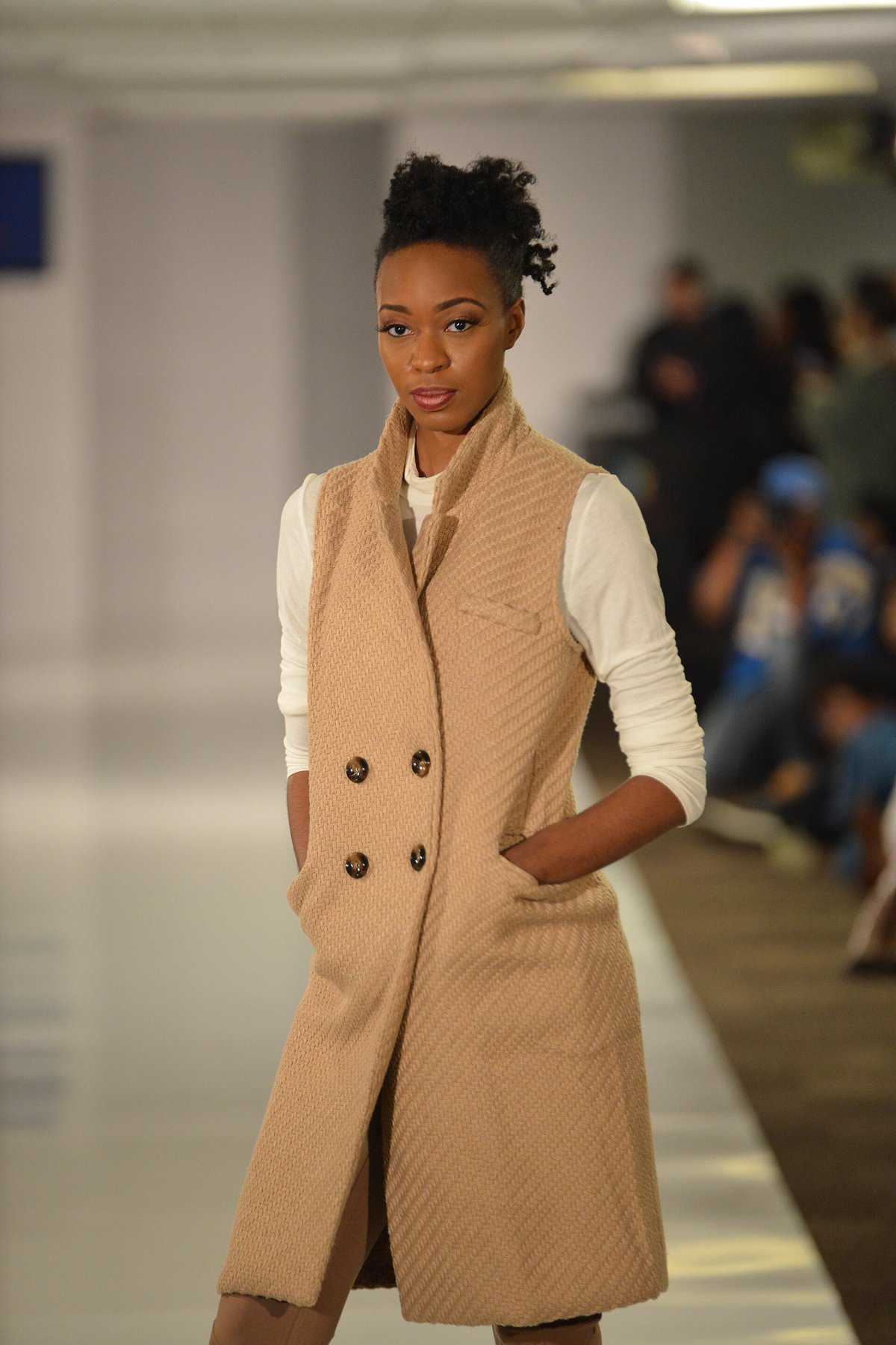Long sleeveless camel vest on runway