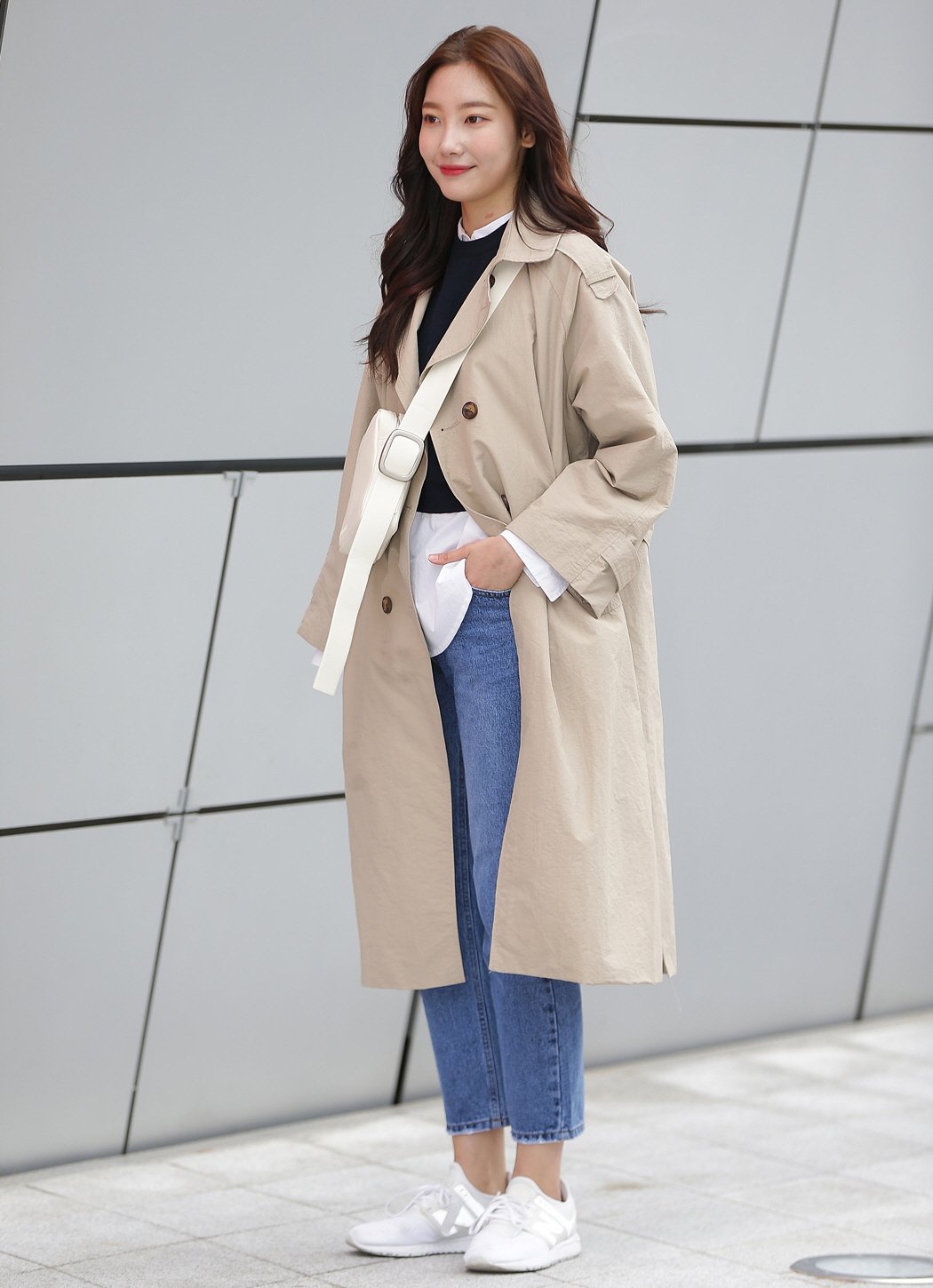 Street style long beige coat with jeans and sneakers