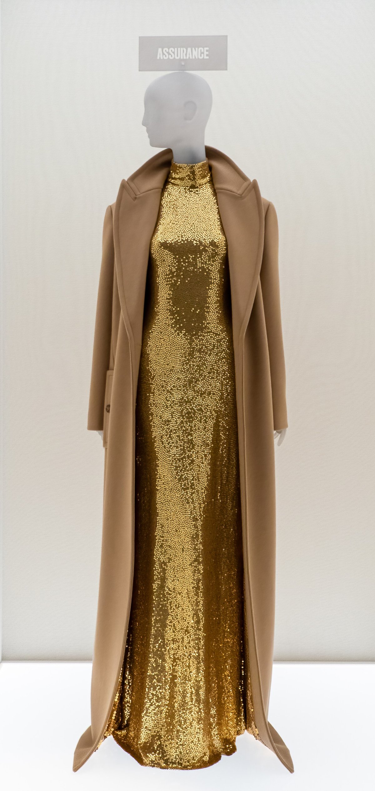 Camel coat over sequin evening gown