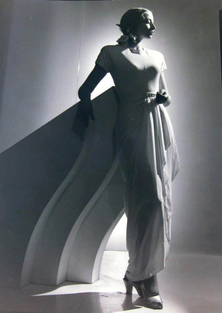 Dancer in a draped white gown with a ballet bun, 1947
