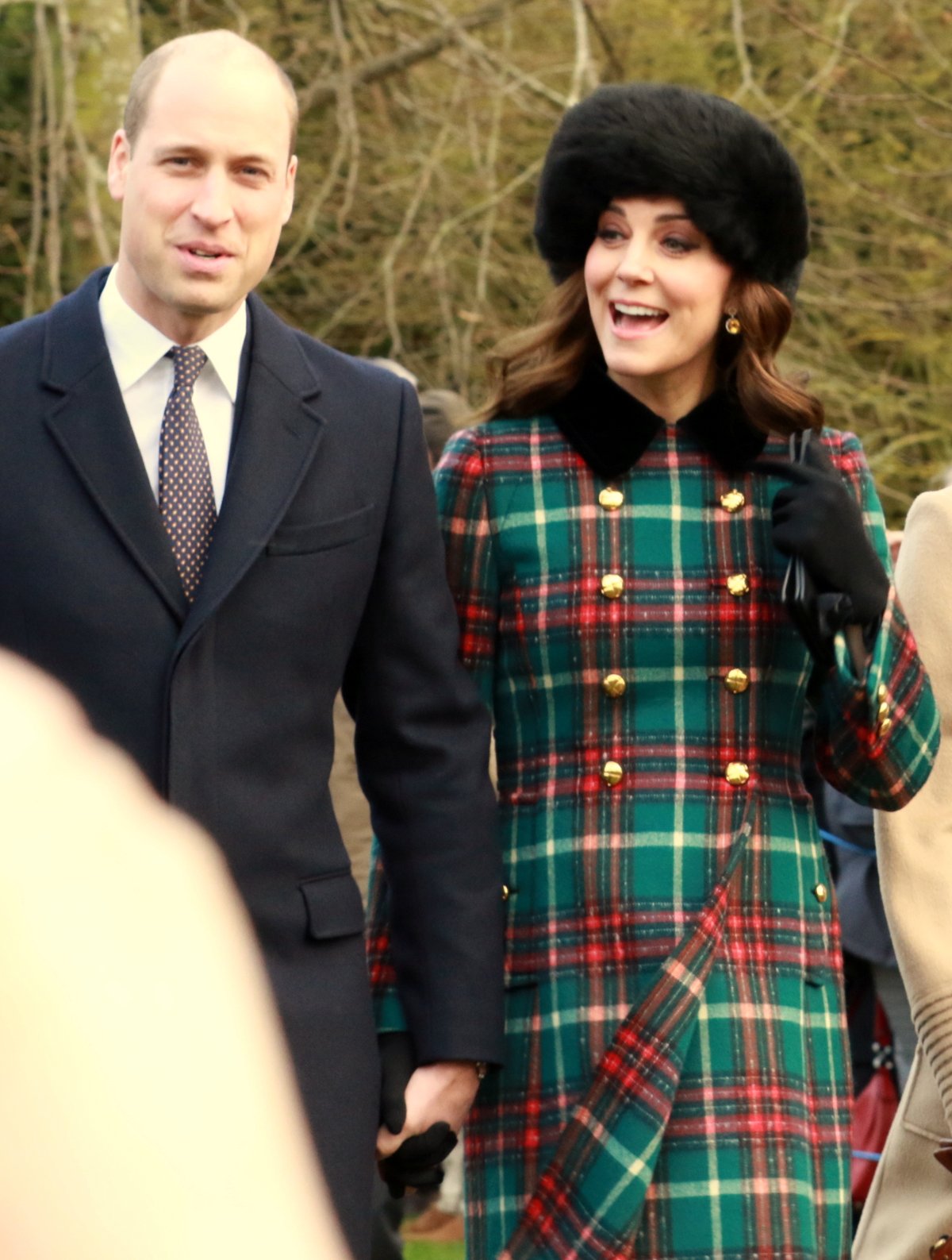 Woman wearing a tartan coat and fur hat on Christmas Day